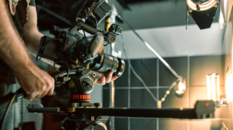 Behind the scenes of filming films or video products and the film crew of the film crew on the set in the pavilion of the film studio. Video Production Concept